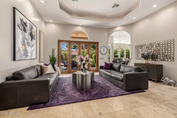 a view of a dining room that has a table and chairs in it