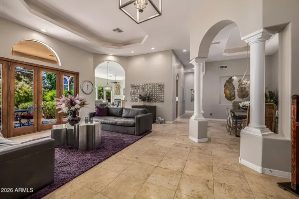 a view of a livingroom with furniture and a flat screen tv