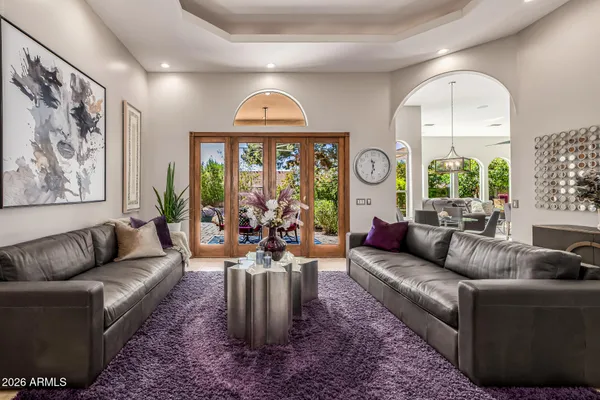a living room with furniture and a large window