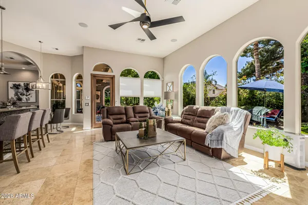a kitchen with stainless steel appliances granite countertop a stove a sink and a white cabinets