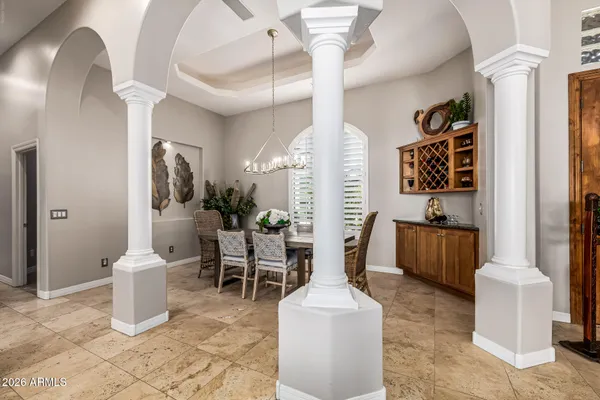 a kitchen with stainless steel appliances granite countertop a sink a stove and a wooden cabinets