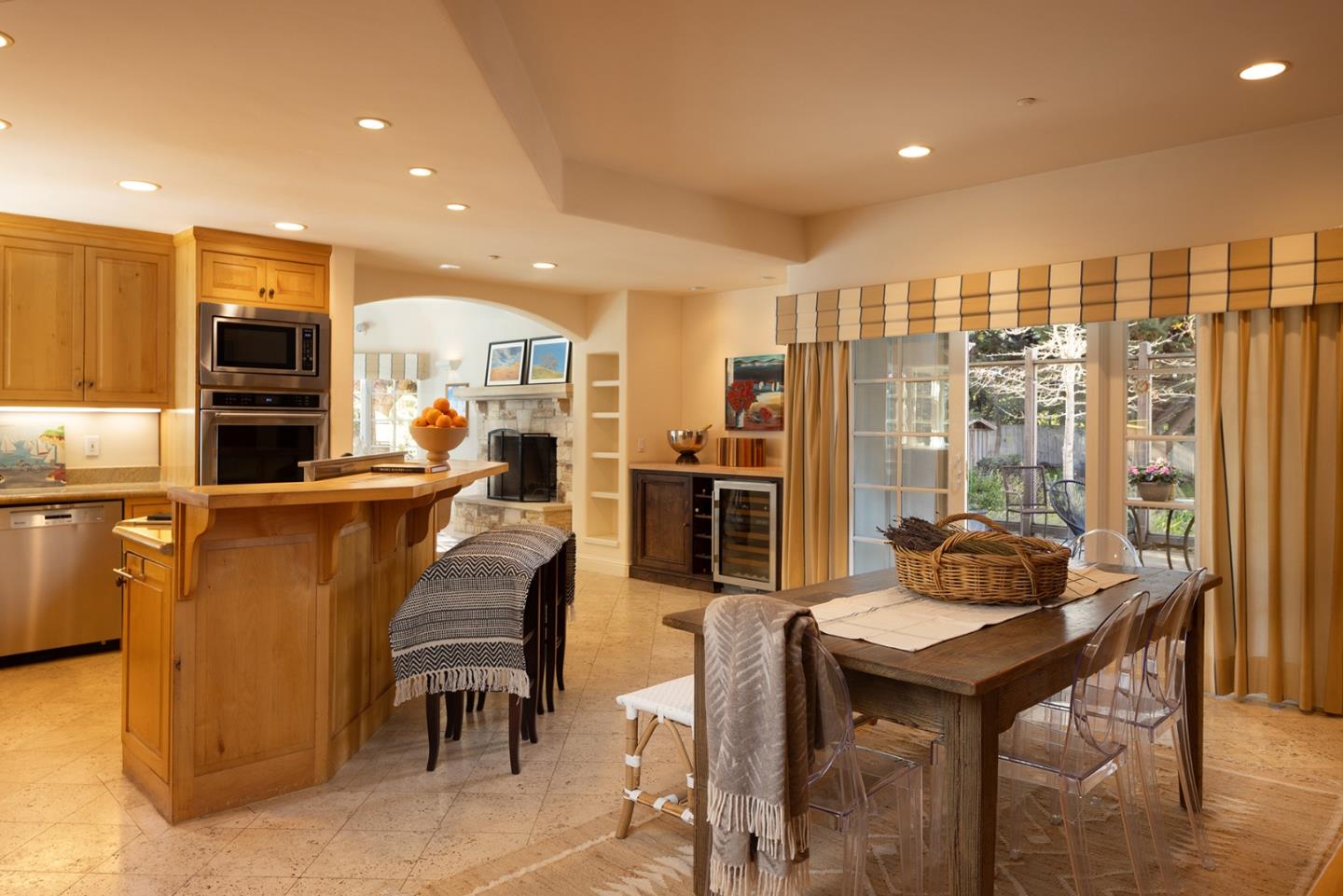 8680 River Meadows Road Carmel, CA 93923 - Photo 13 of 38 a living room with stainless steel appliances kitchen island granite countertop furniture and a kitchen view
