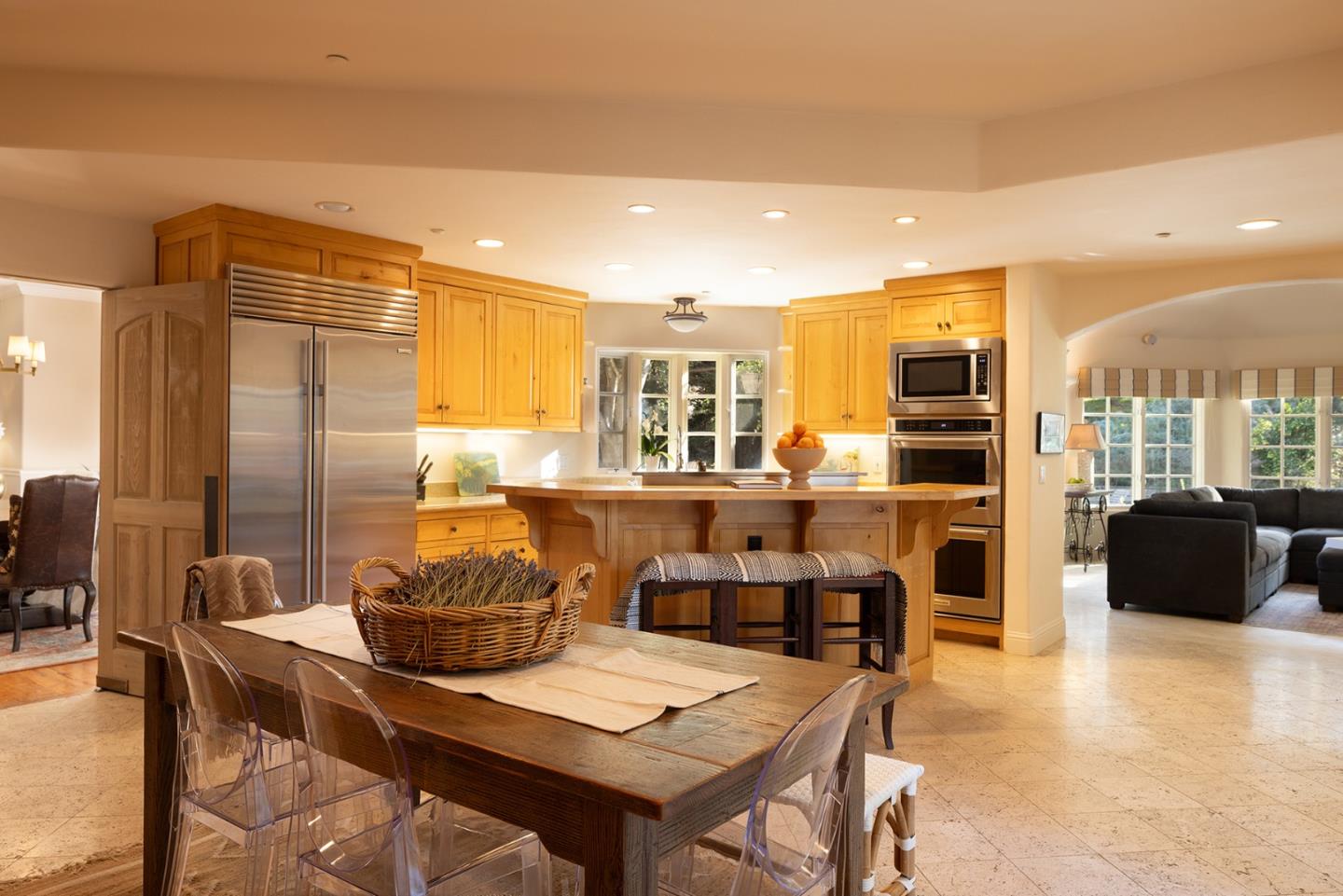 8680 River Meadows Road Carmel, CA 93923 - Photo 15 of 38 a room with stainless steel appliances kitchen island granite countertop furniture and a kitchen view
