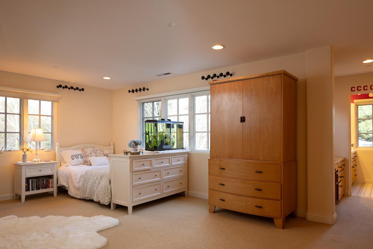 8680 River Meadows Road Carmel, CA 93923 - Photo 25 of 38 a bedroom with a bed and a dresser