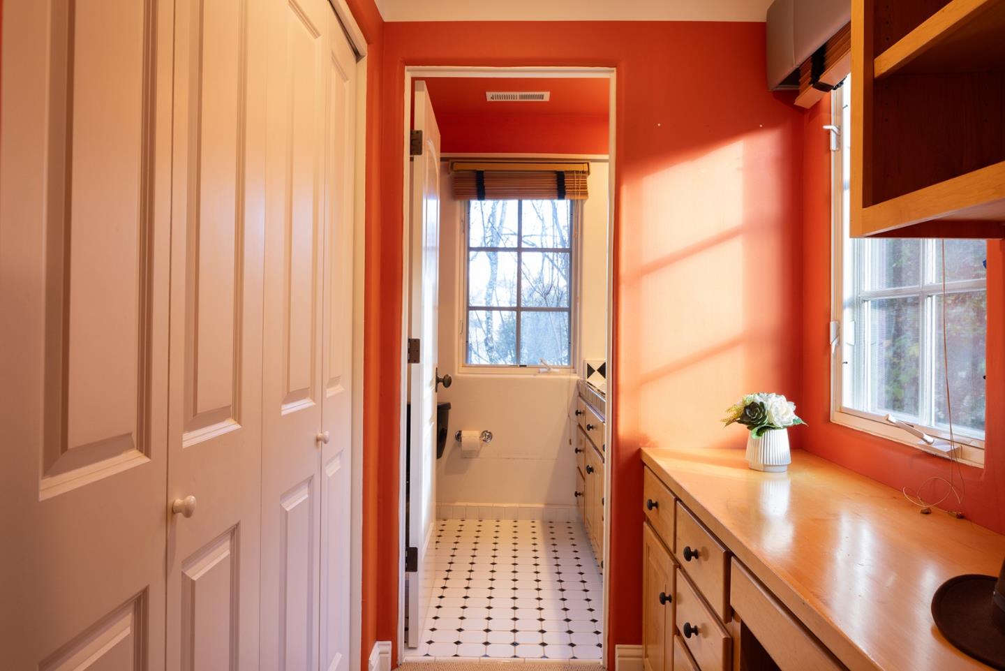 8680 River Meadows Road Carmel, CA 93923 - Photo 28 of 38 a view of a hallway with a window and wooden floor