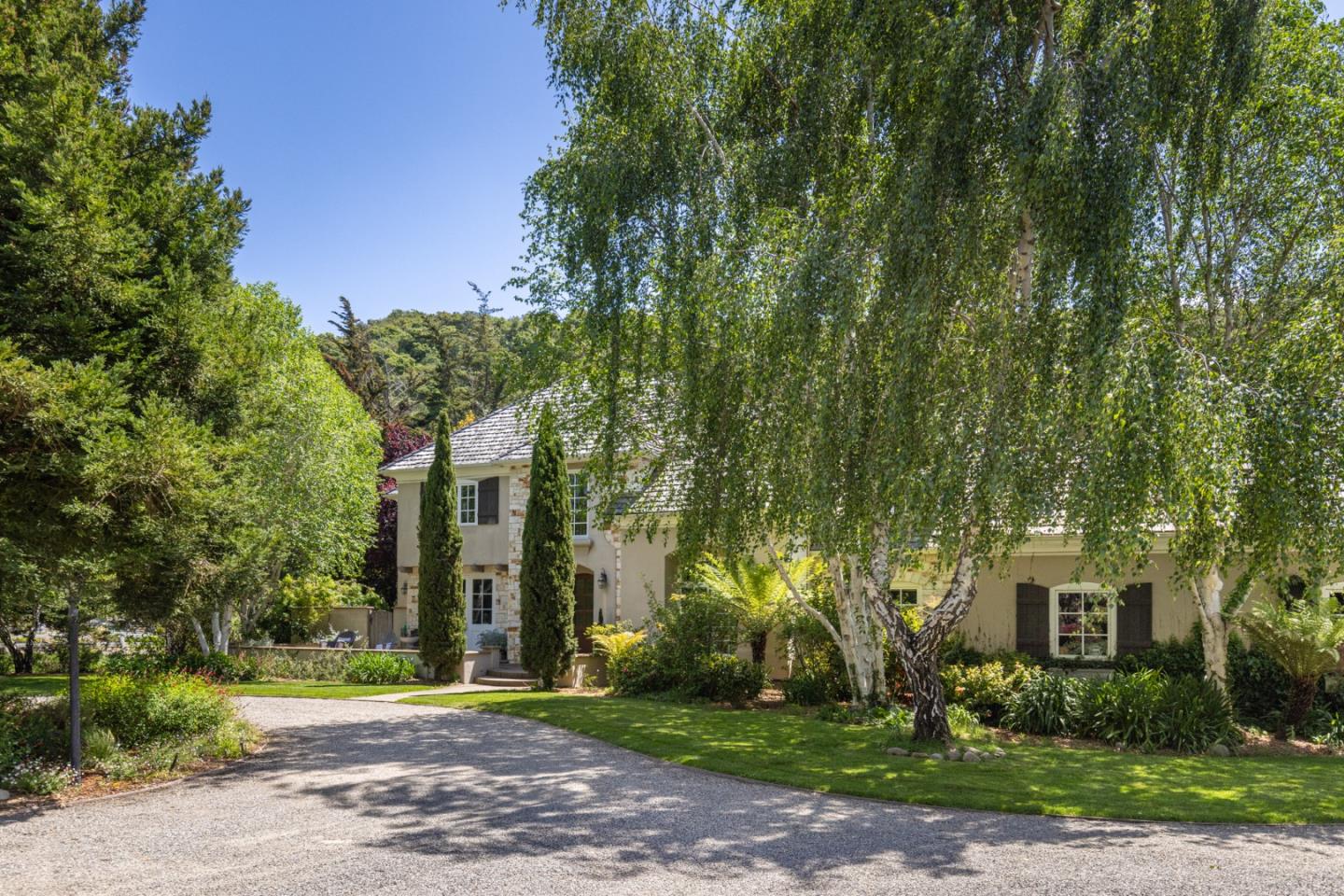 8680 River Meadows Road Carmel, CA 93923 - Photo 3 of 38 a front view of a house with a yard