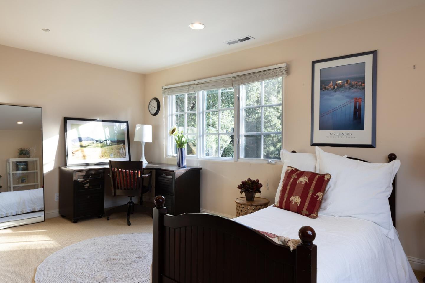 8680 River Meadows Road Carmel, CA 93923 - Photo 31 of 38 a bedroom with furniture and large windows