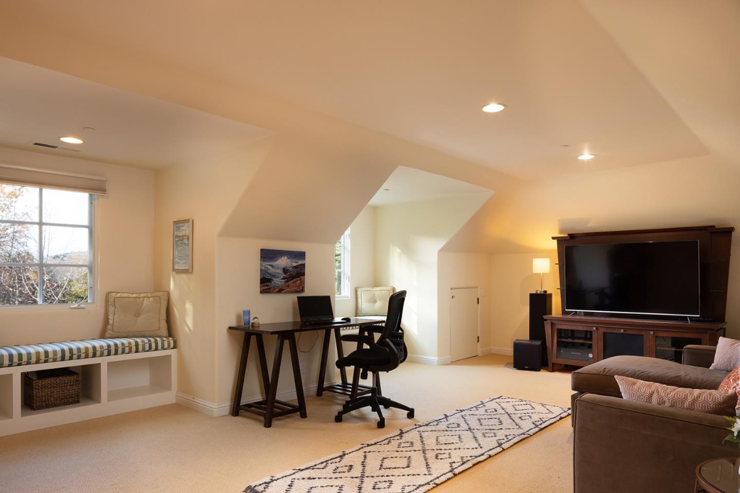 8680 River Meadows Road Carmel, CA 93923 - Photo 32 of 38 a living room with furniture and a flat screen tv