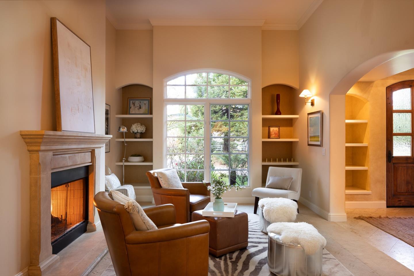 8680 River Meadows Road Carmel, CA 93923 - Photo 7 of 38 a living room with furniture a fireplace and a large window