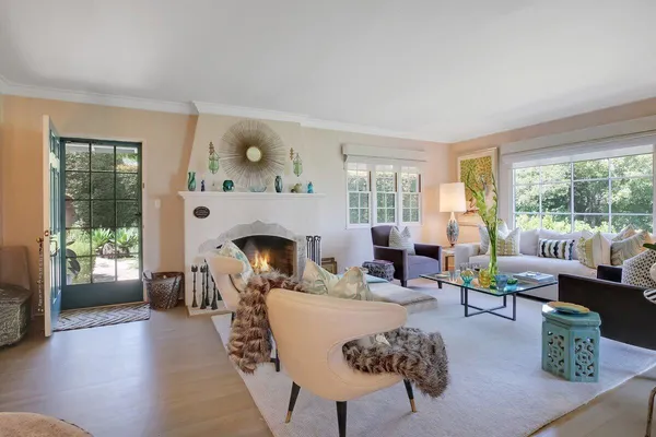 a living room with furniture and a fireplace