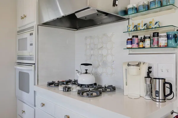 a bathroom with a refrigerator and a sink