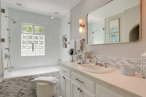 a bathroom with a sink and a mirror