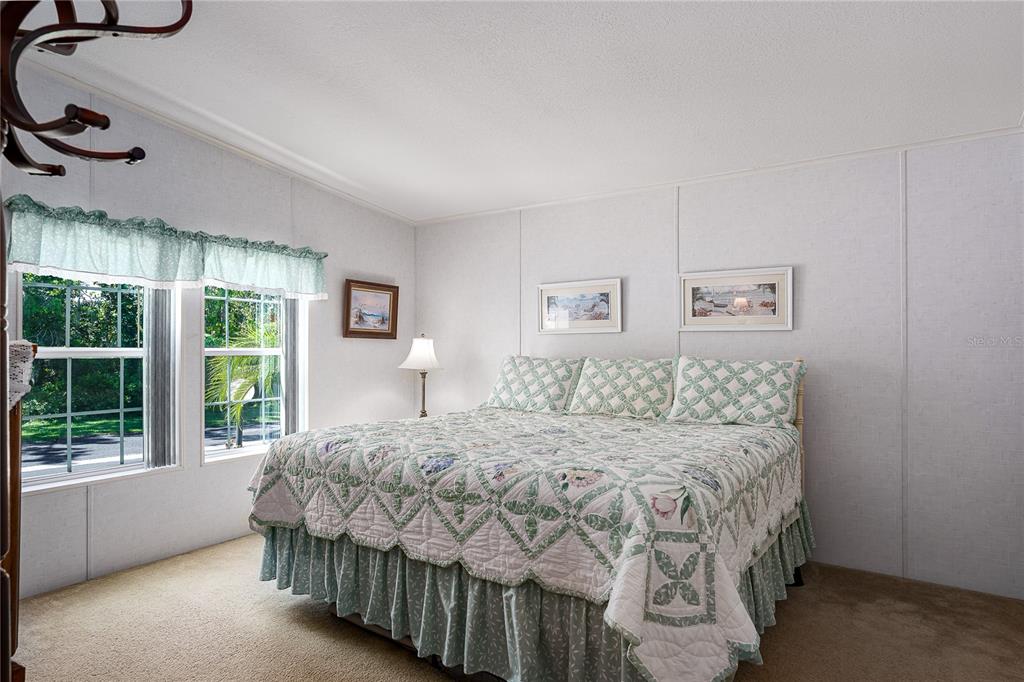 8012 Nancy Lane Ellenton, FL 34222 - Photo 18 of 28 a bedroom with a large bed and a window