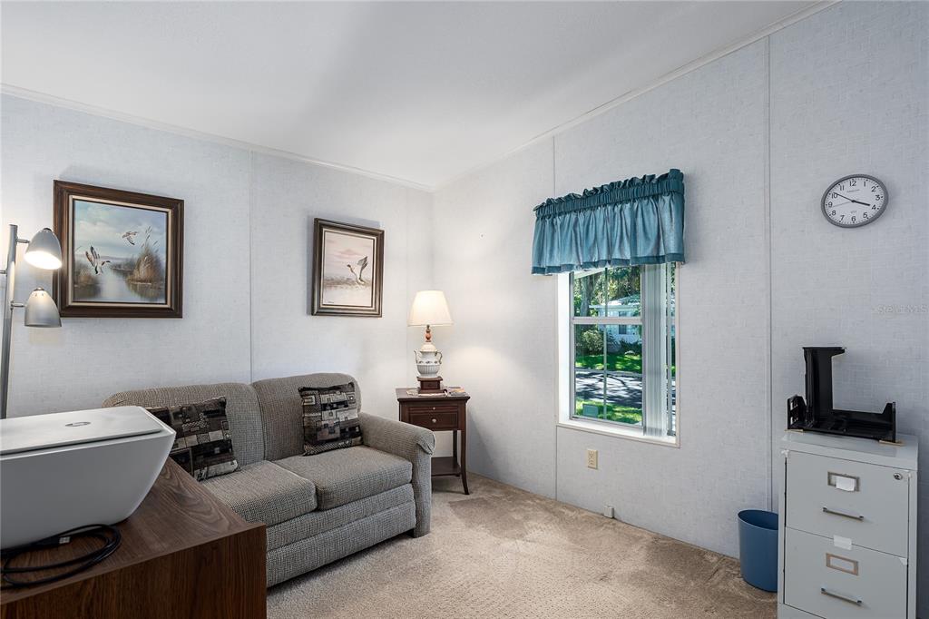 8012 Nancy Lane Ellenton, FL 34222 - Photo 20 of 28 a living room with furniture a window and a lamp
