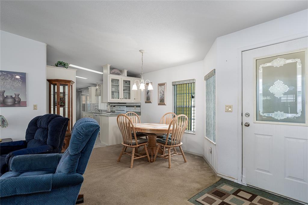 8012 Nancy Lane Ellenton, FL 34222 - Photo 7 of 28 a dining room with furniture and window