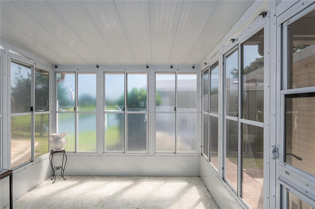 8012 Nancy Lane Ellenton, FL 34222 - Photo 10 of 28 a view of an empty room with a sliding door