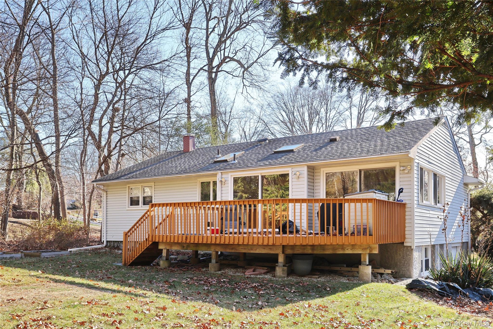 160 Pascack Road Chestnut Ridge, NY 10965 - Photo 2 of 25 a view of a house with a yard chairs and wooden fence