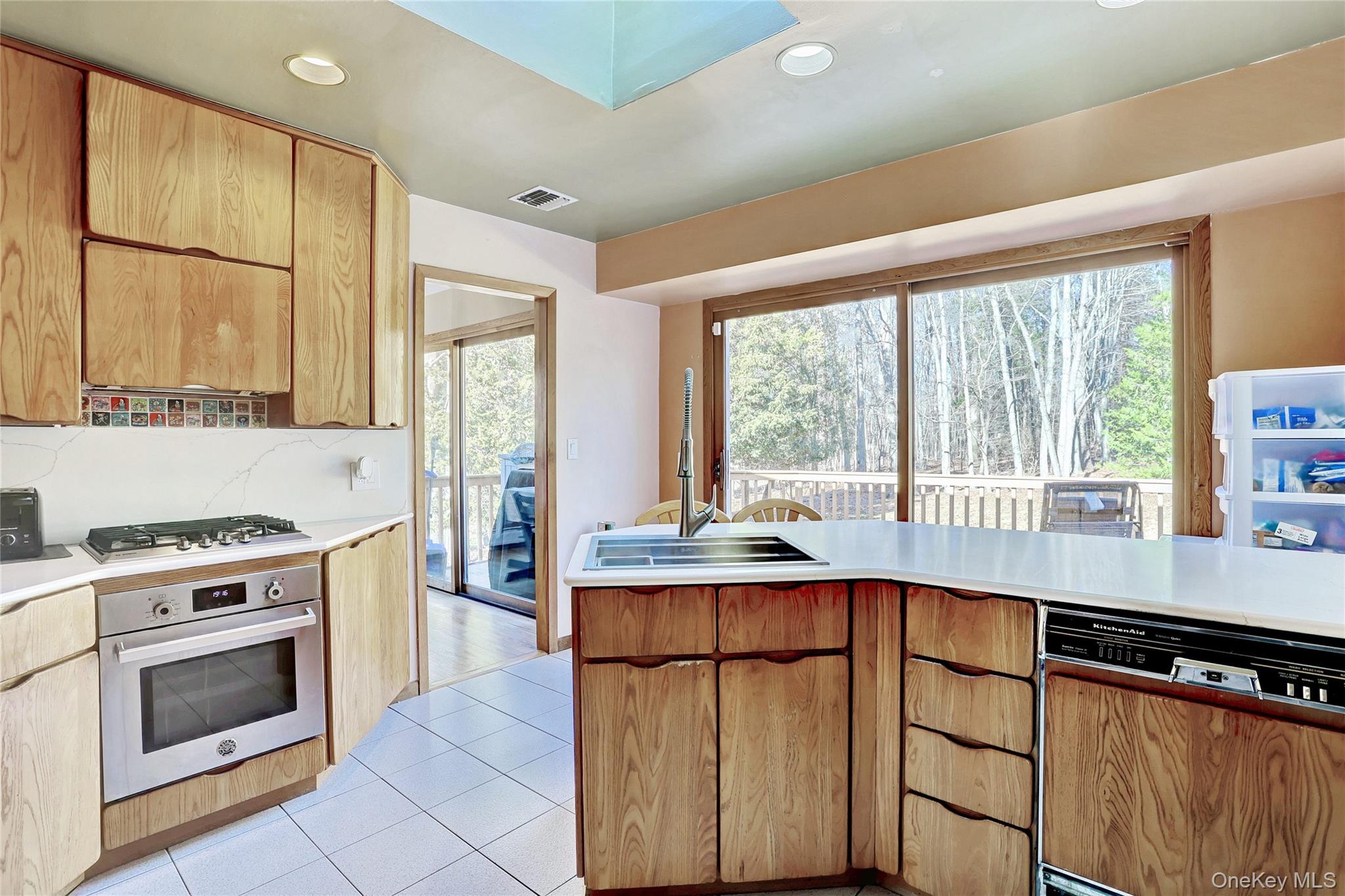 160 Pascack Road Chestnut Ridge, NY 10965 - Photo 7 of 25 a kitchen with stainless steel appliances a stove sink and cabinets
