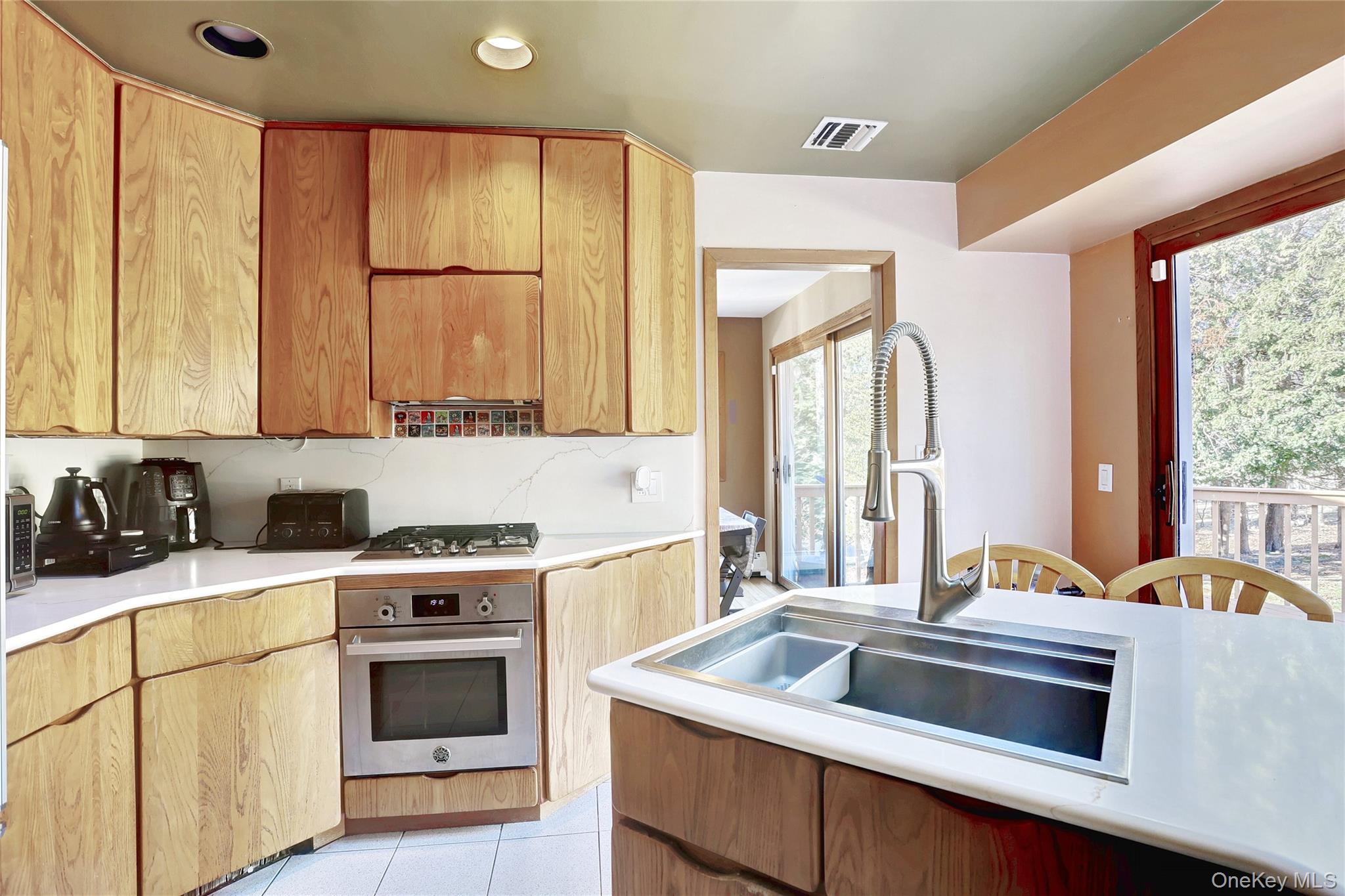 160 Pascack Road Chestnut Ridge, NY 10965 - Photo 8 of 25 a kitchen with a stove a sink and a refrigerator