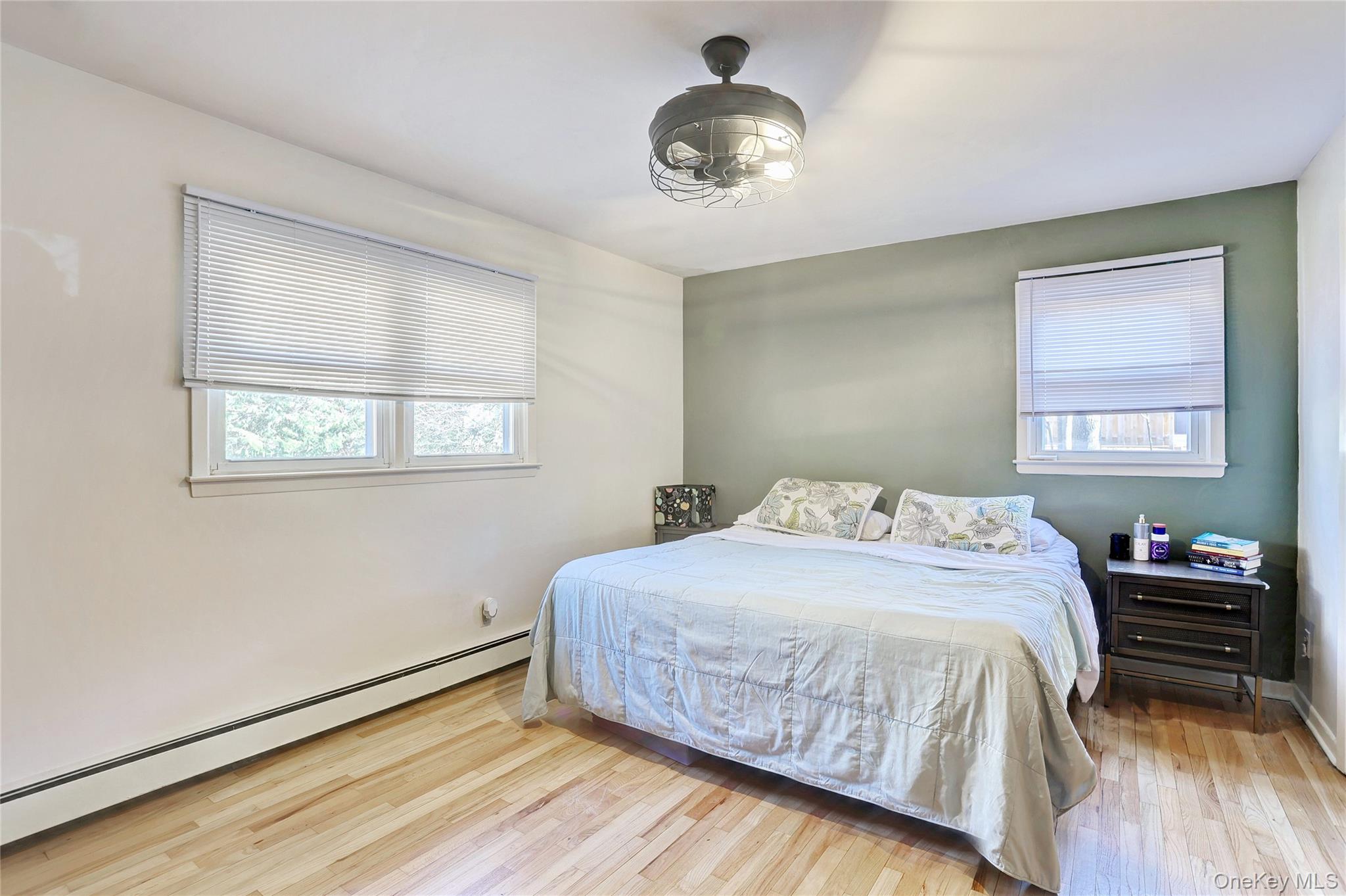 160 Pascack Road Chestnut Ridge, NY 10965 - Photo 9 of 25 a bedroom with a bed and wooden floor