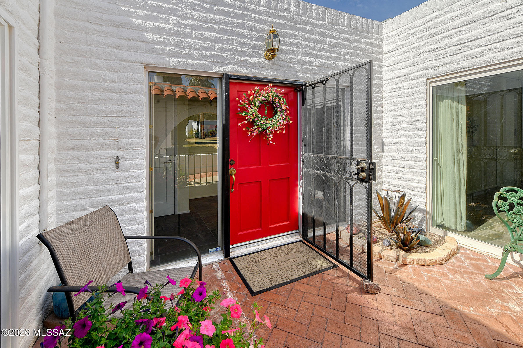 719 West Las Lomitas Road Tucson, AZ 85704 - Photo 11 of 44 a view of a porch with a bench