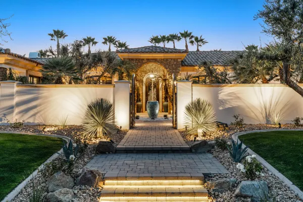 a view of swimming pool with a yard and plants