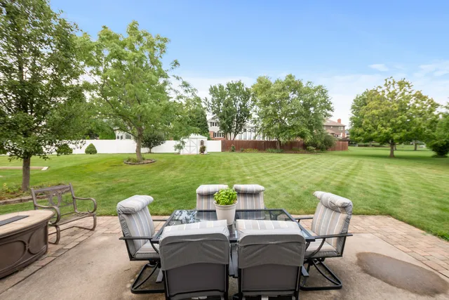 a view of a table and chairs on the deck