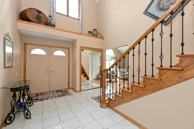 a view of entryway and hall with a front door