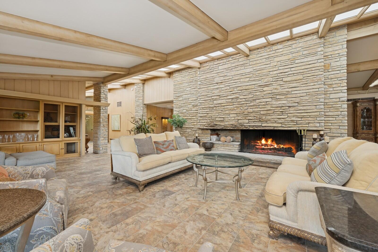 W1800 County Road B Bloomfield, WI 53128 - Photo 32 of 81 An inviting gathering space centered around the fireplace, with generous seating and warm finishes ideal for everyday living or entertaining.