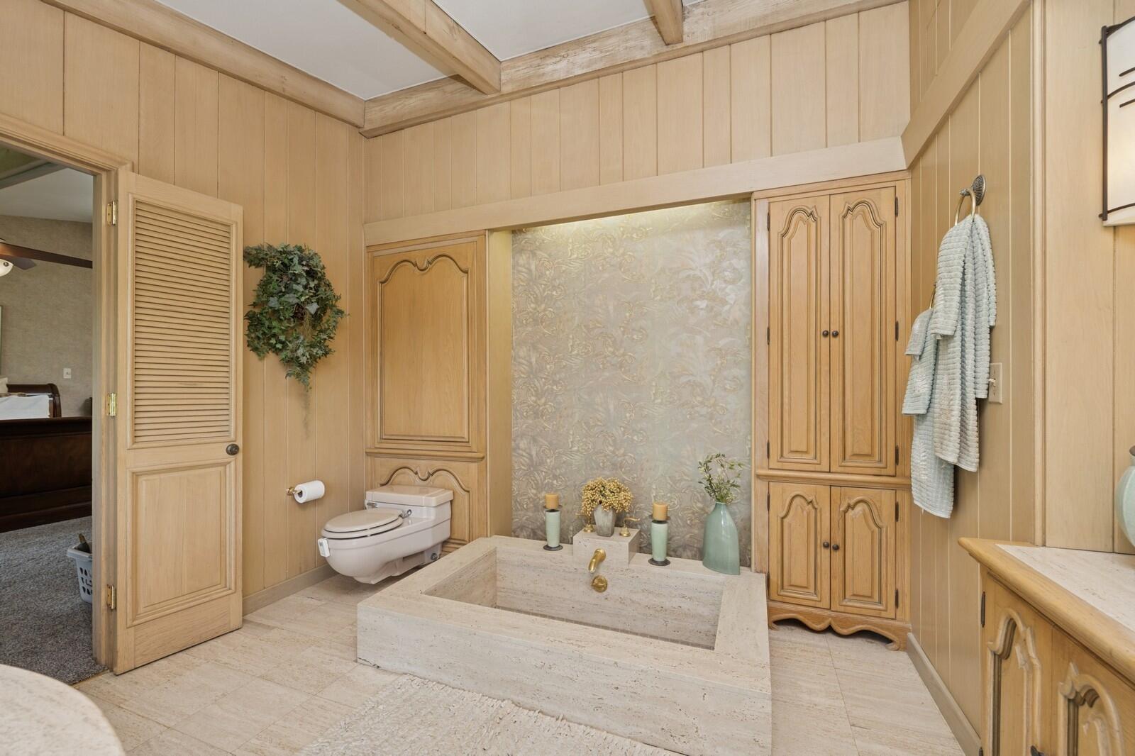 W1800 County Road B Bloomfield, WI 53128 - Photo 43 of 81 Additional view of the bathroom highlighting built-in storage, wood cabinetry, and thoughtfully designed layout.