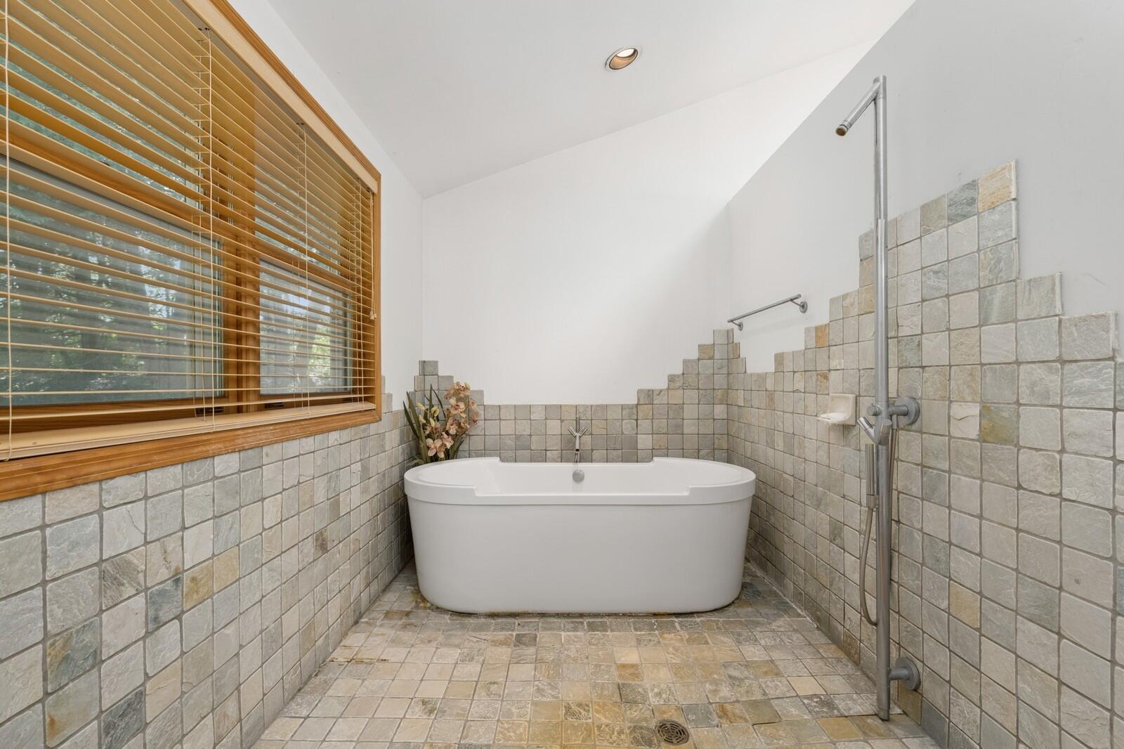 W1800 County Road B Bloomfield, WI 53128 - Photo 72 of 81 Spa-inspired bath with soaking tub, tiled surround, and walk-in shower, designed for relaxation and everyday use.