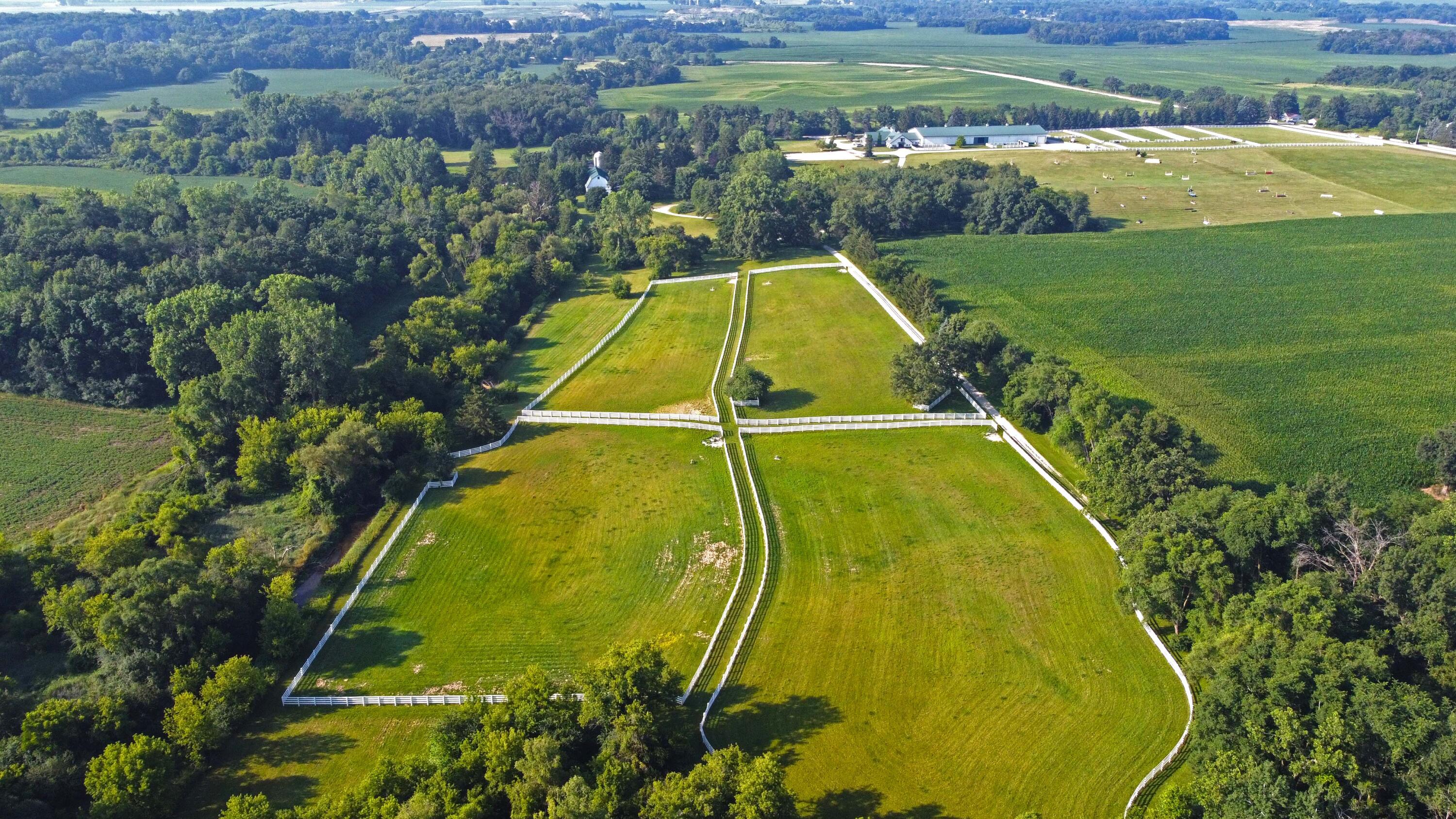 W1800 County Road B Bloomfield, WI 53128 - Photo 79 of 81 - Back pastures have over 200’ of underground watering system and electrical line to support 4 Nelson automatic waters for each pasture (designed for cold winters). Dedicated well and pressure tank. Pastures also feature a metal run-in shed.