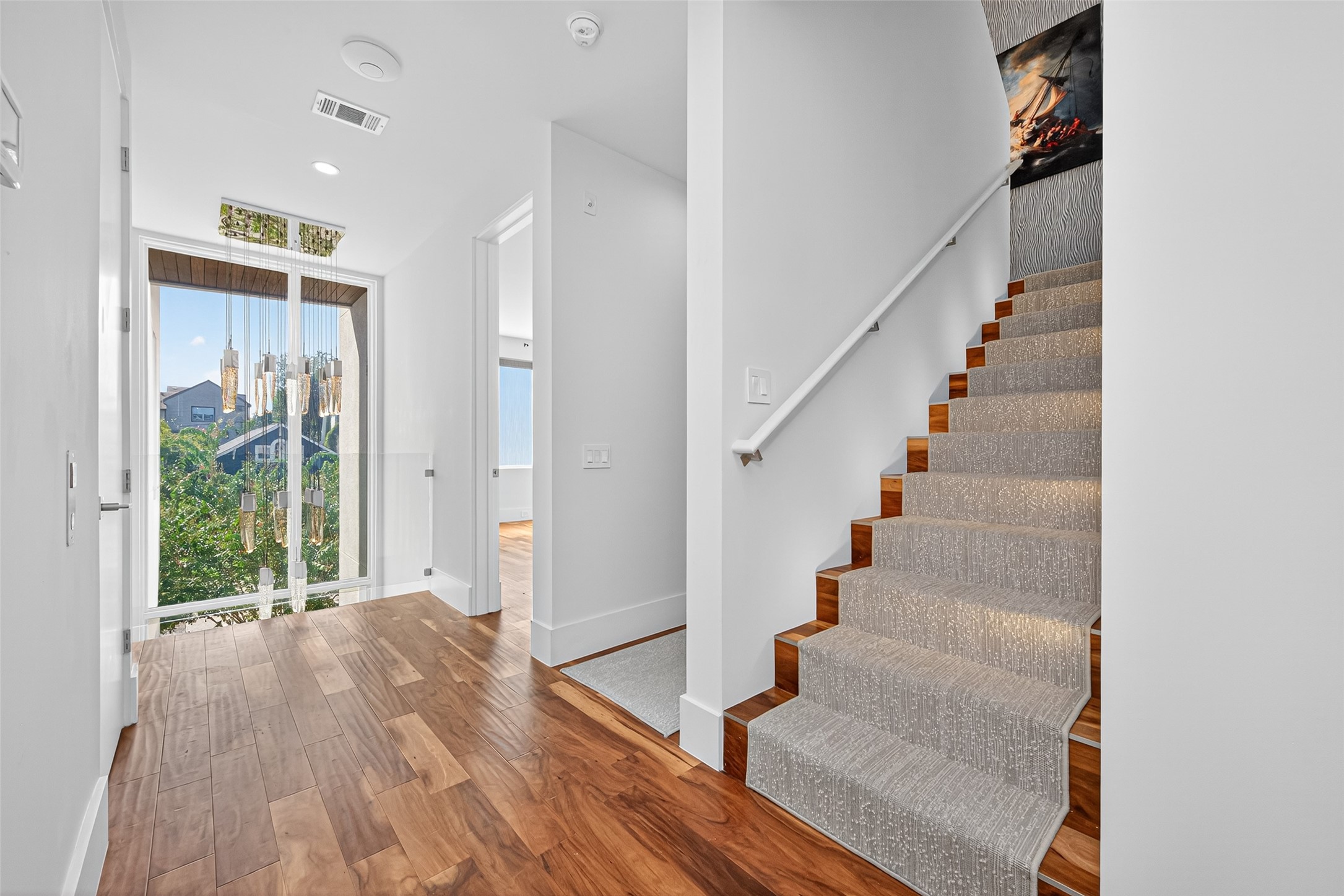 211 Stratford Street Houston, TX 77006 - Photo 13 of 33 a view of entryway and hall with wooden floor