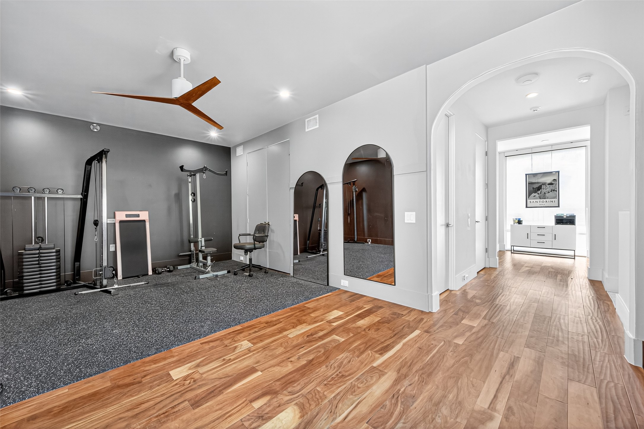211 Stratford Street Houston, TX 77006 - Photo 27 of 33 a view of a hallway with bathroom and wooden floor