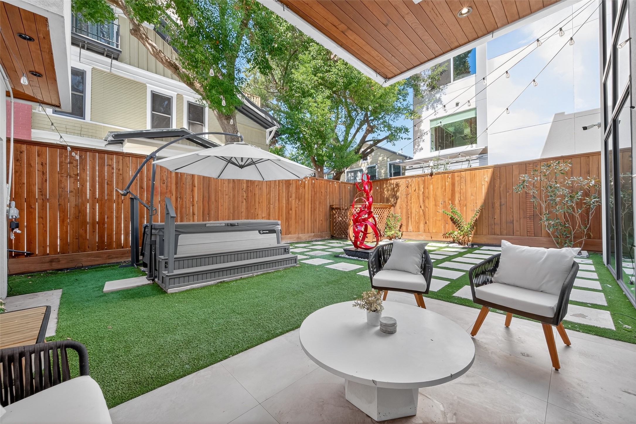 211 Stratford Street Houston, TX 77006 - Photo 30 of 33 a view of backyard with deck and outdoor seating