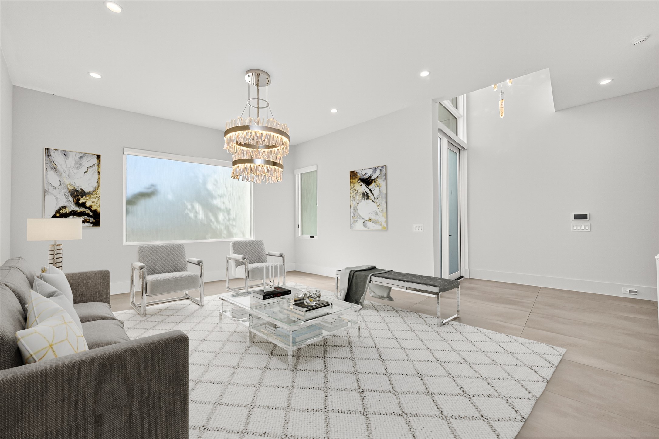 211 Stratford Street Houston, TX 77006 - Photo 3 of 33 a living room with furniture a chandelier and a window