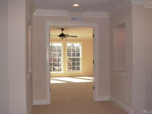 2204 Clayette Court Raleigh, NC 27612 - Photo 7 of 10 Second floor boasts 9 ft ceilings, Master suite, 3 large secondary bedrooms, 3 full baths, & loft area for computer desk. Step up entry to large bonus room has built in niche w/mini can lights.
