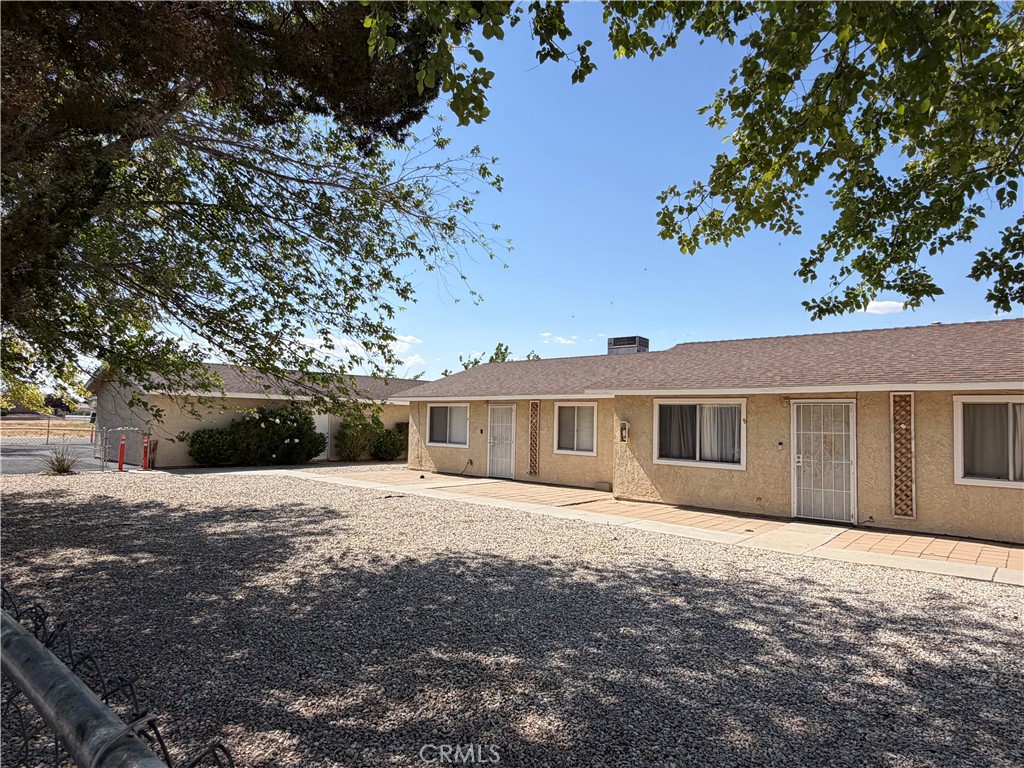 13269 Mohawk Road Apple Valley, CA 92308 - Photo 6 of 8 front view of a house with a yard