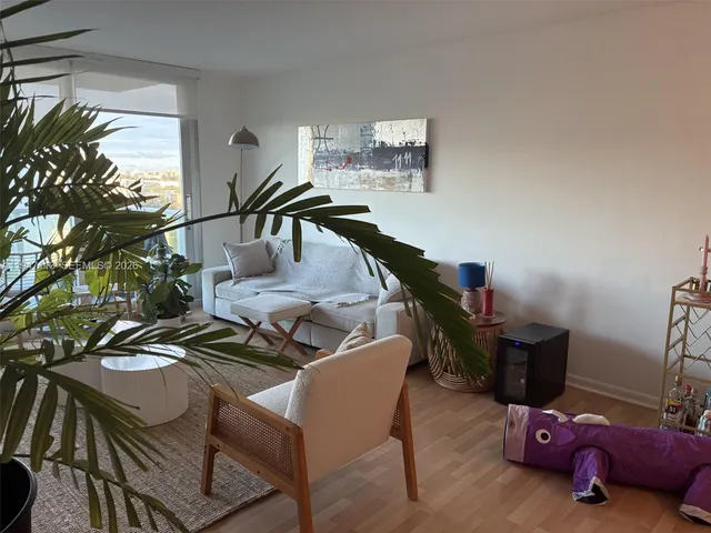 a white toilet sitting next to a bath tub shower