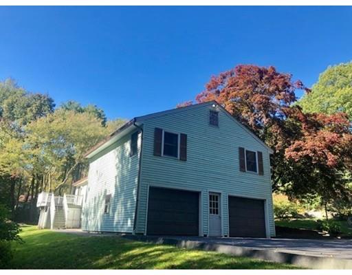 158 Hartness Road Sutton, MA 01590 - Photo 3 of 40 a front view of a house with a yard