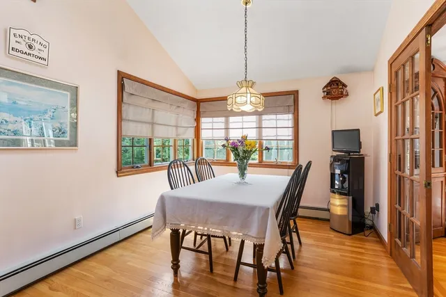 a view of a dining room with furniture window and wooden floor