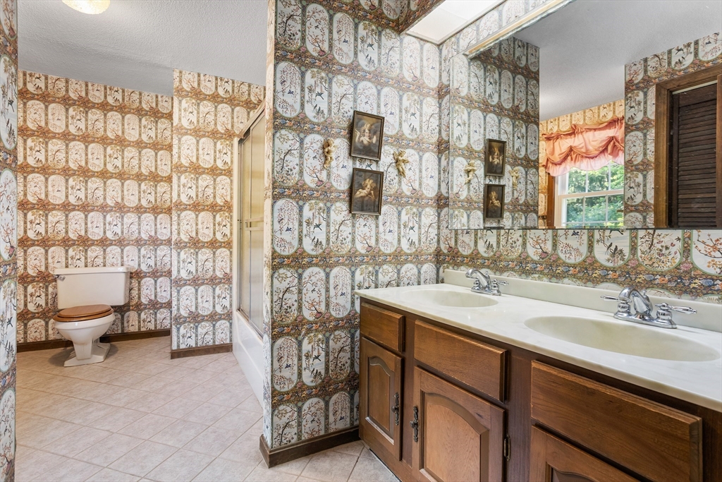 40 Saw Mill Road Stow, MA 01775 - Photo 25 of 42 a bathroom with a sink and a shower