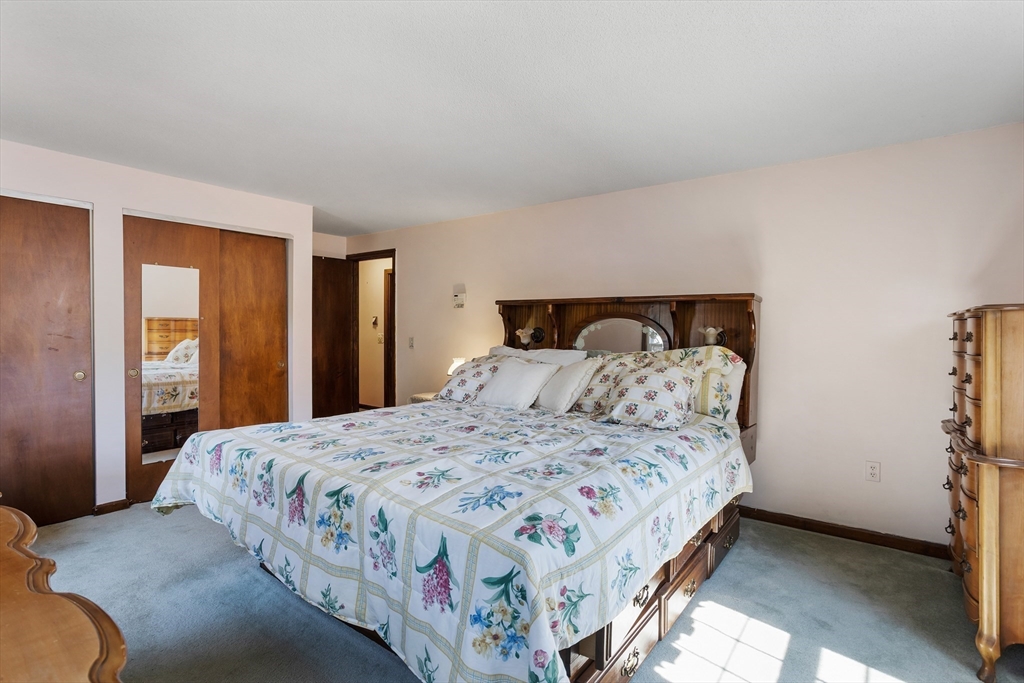 40 Saw Mill Road Stow, MA 01775 - Photo 27 of 42 a bedroom with a bed and a closet