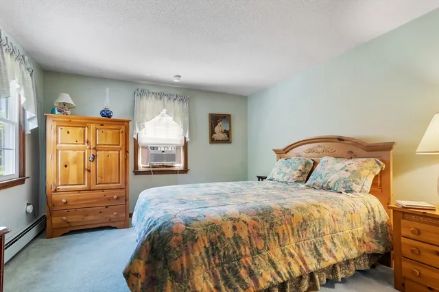 a bedroom with a bed and a desk