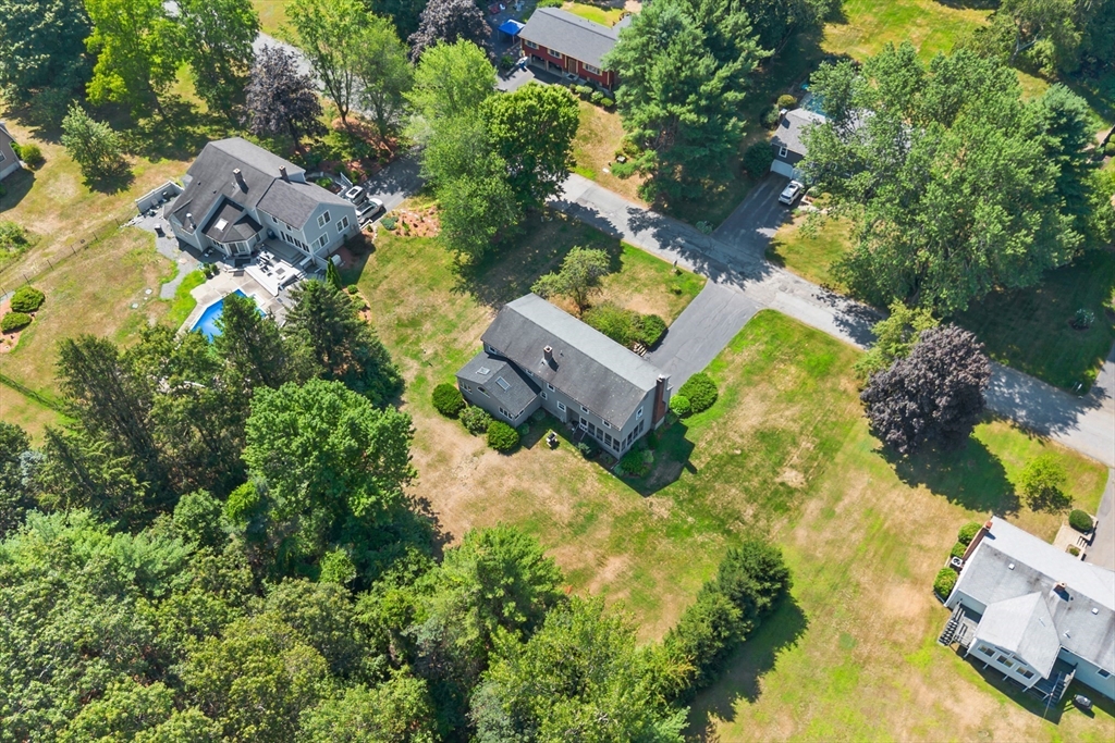 40 Saw Mill Road Stow, MA 01775 - Photo 40 of 42 an aerial view of a house with a yard basket ball court and outdoor seating