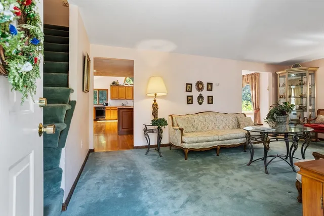 a bedroom with furniture and a potted plant