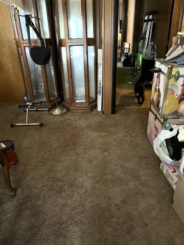 a view of a house with a small yard and plants