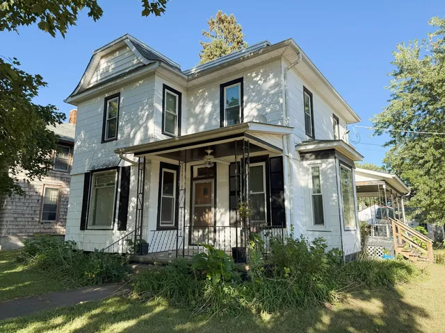 front view of a house with a small yard