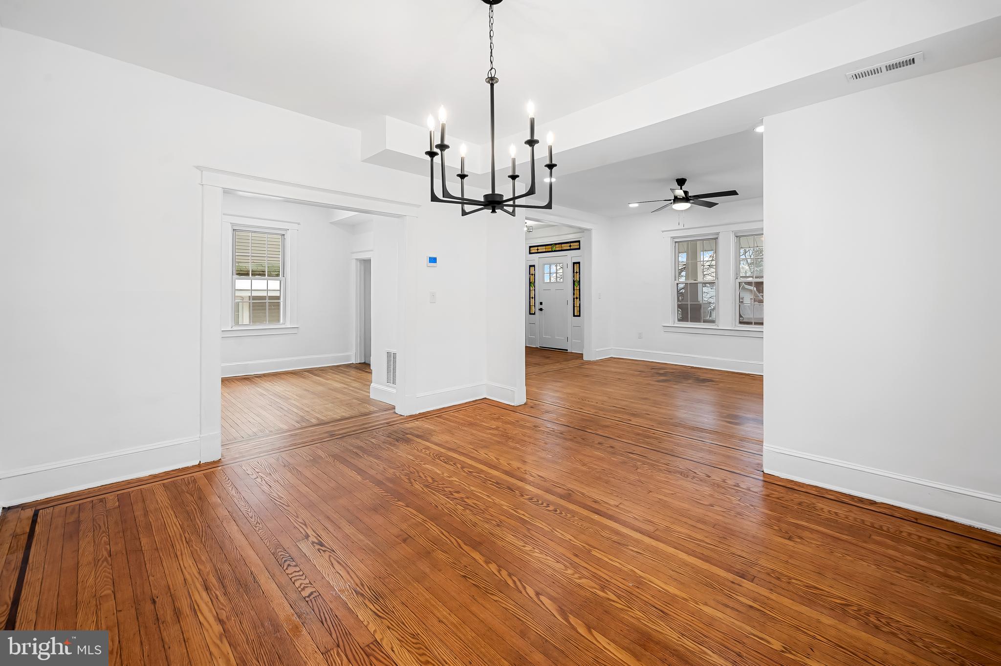 709 Elmwood Road Baltimore, MD 21206 - Photo 8 of 39 a view of a kitchen with wooden floor and windows