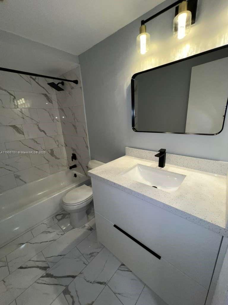 1799 Southwest 81st Terrace, Unit 135 Davie, FL 33324 - Photo 11 of 19 a bathroom with a sink a toilet and a bathtub